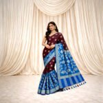 Wine Maroon Muslin Saree with royal blue contrast pallu and woven motifs